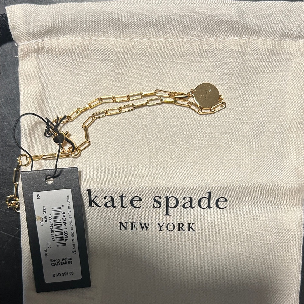 kate spade “T”  gold chain bracelet with logo disc